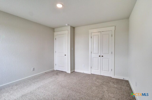 3644 Meteor Rd, New Braunfels, TX 78130 - unfurnished bedroom featuring baseboards, carpet floors, and a closet