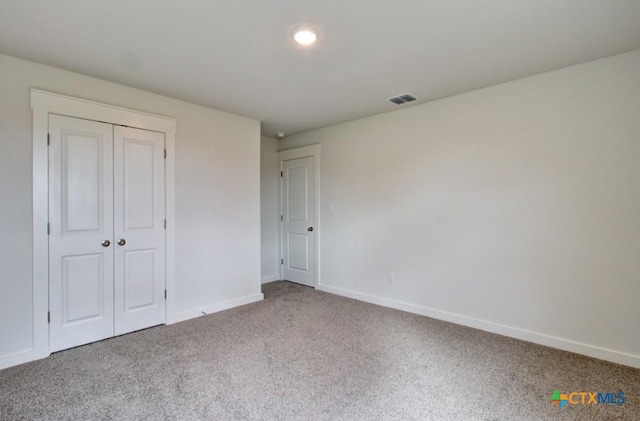 3644 Meteor Rd, New Braunfels, TX 78130 - unfurnished bedroom with visible vents, a closet, baseboards, and carpet floors