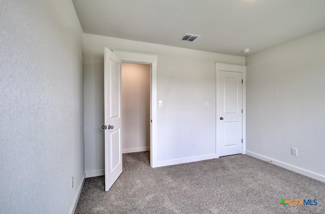 3644 Meteor Rd, New Braunfels, TX 78130 - unfurnished bedroom featuring carpet, visible vents, and baseboards