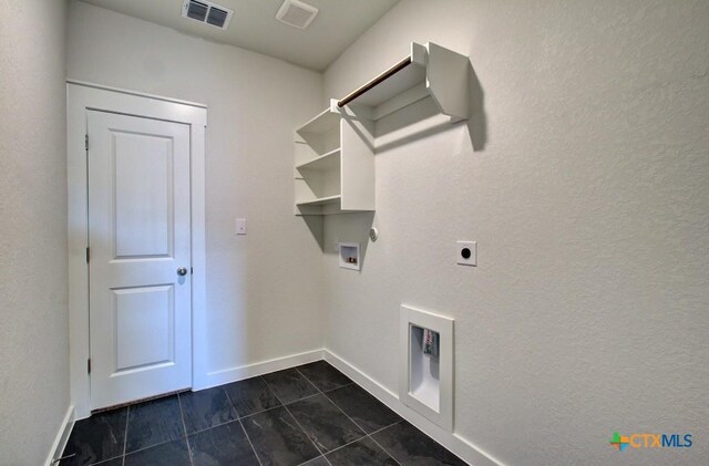 3644 Meteor Rd, New Braunfels, TX 78130 - laundry area with hookup for an electric dryer, washer hookup, visible vents, baseboards, and laundry area