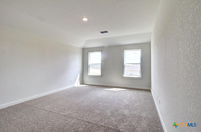 3644 Meteor Rd, New Braunfels, TX 78130 - unfurnished room featuring baseboards, visible vents, carpet, and a textured wall