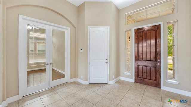 322 Wauford Way, New Braunfels, TX 78132 - entryway featuring light tile patterned floors, french doors, and baseboards