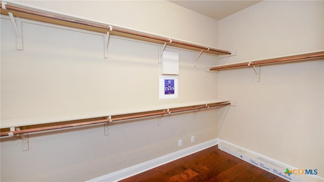 322 Wauford Way, New Braunfels, TX 78132 - spacious closet featuring dark wood-style floors