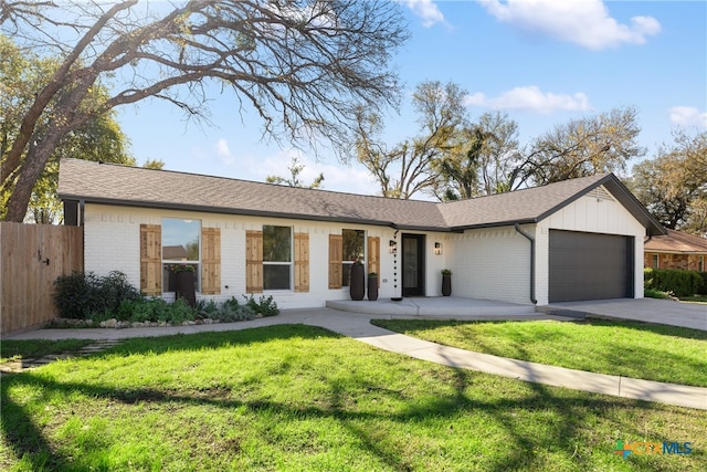 ranch-style house with a front lawn and a garage