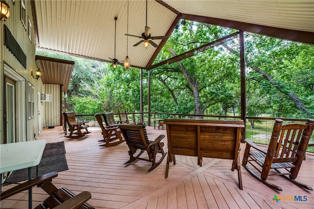 wooden deck featuring ceiling fan