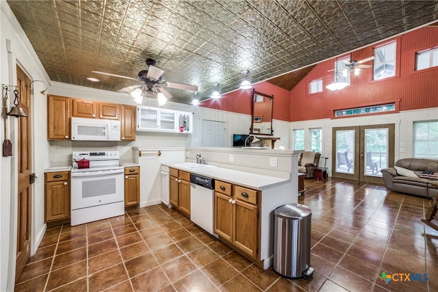 kitchen with open floor plan, an ornate ceiling, a peninsula, and white appliances