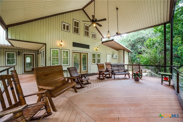 deck featuring a wall mounted AC and ceiling fan