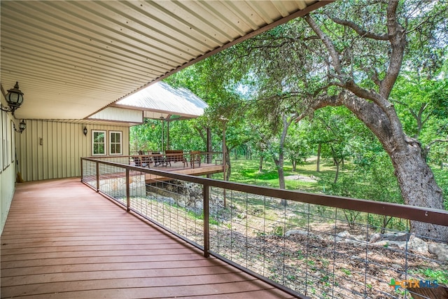 deck featuring outdoor dining area