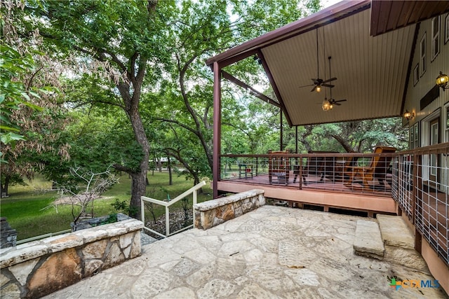 view of patio / terrace with a wooden deck and a ceiling fan