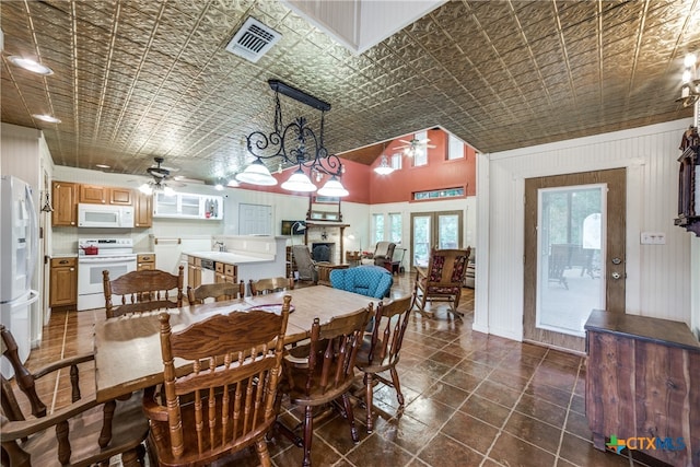 dining space featuring visible vents, an ornate ceiling, and ceiling fan