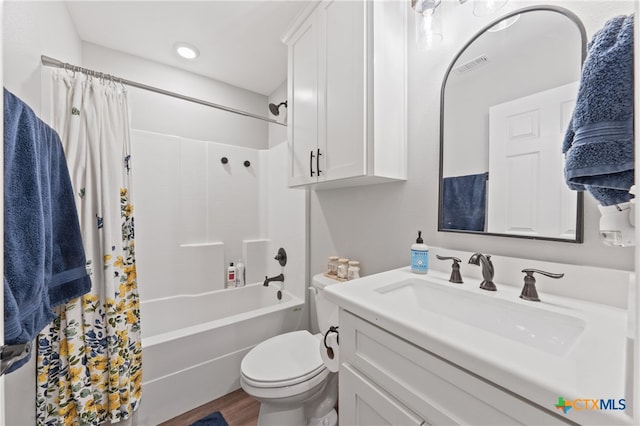 full bathroom with toilet, shower / bath combination with curtain, vanity, and hardwood / wood-style floors