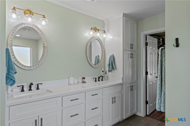 bathroom with vanity and hardwood / wood-style flooring