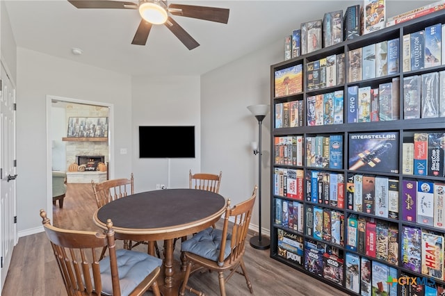 dining room with hardwood / wood-style flooring and ceiling fan