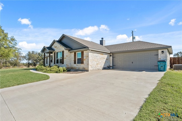 view of front facade with a garage and a front yard