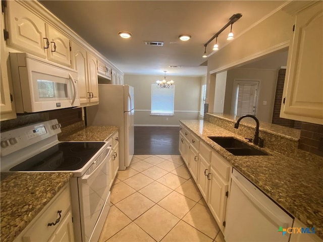 505 Sun Meadows Dr, Harker Heights, TX 76548 - kitchen featuring white appliances, a sink, decorative backsplash, light tile patterned floors, and a chandelier
