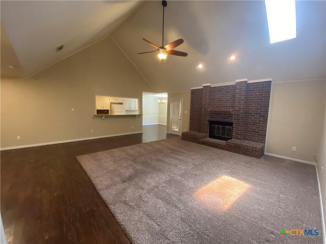 505 Sun Meadows Dr, Harker Heights, TX 76548 - unfurnished living room featuring ceiling fan, a brick fireplace, baseboards, dark wood-style flooring, and high vaulted ceiling