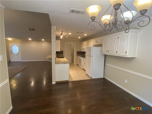 505 Sun Meadows Dr, Harker Heights, TX 76548 - kitchen featuring white appliances, a chandelier, white cabinets, light wood-style floors, and recessed lighting