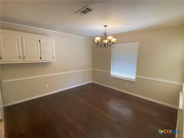 505 Sun Meadows Dr, Harker Heights, TX 76548 - unfurnished room with dark wood-type flooring, a chandelier, baseboards, and crown molding