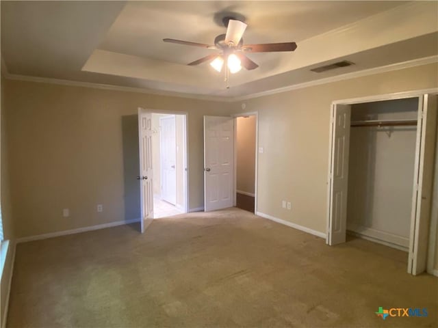 505 Sun Meadows Dr, Harker Heights, TX 76548 - unfurnished bedroom featuring a tray ceiling, baseboards, carpet, and crown molding