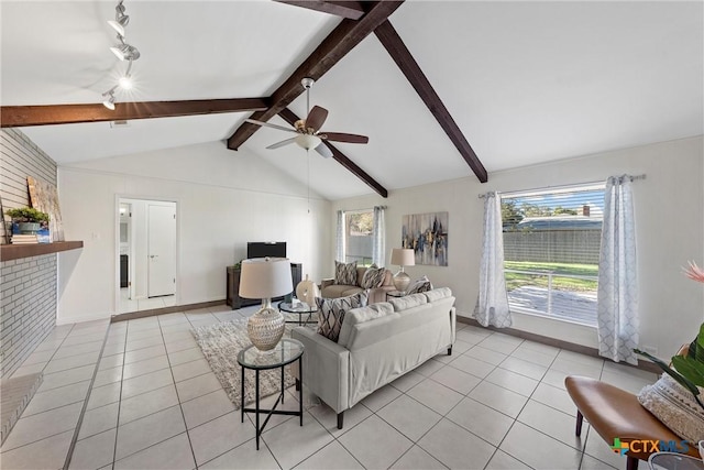 living room with ceiling fan, light tile patterned floors, and vaulted ceiling with beams