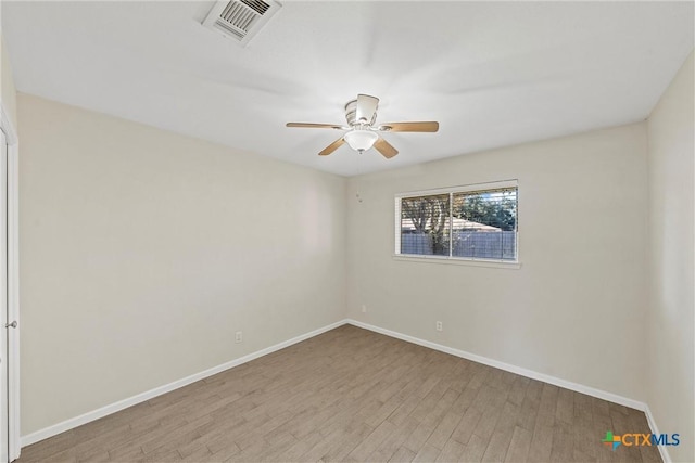 unfurnished room with ceiling fan and light hardwood / wood-style floors