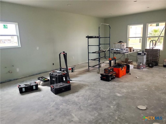 interior space featuring unfinished concrete flooring