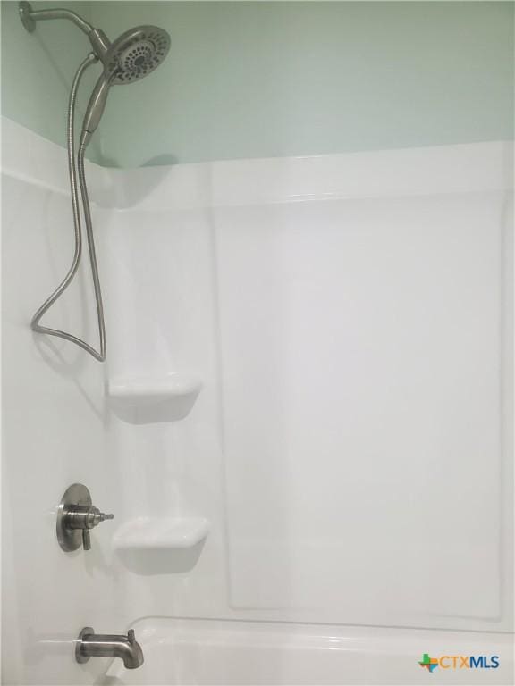 details featuring bathtub / shower combination