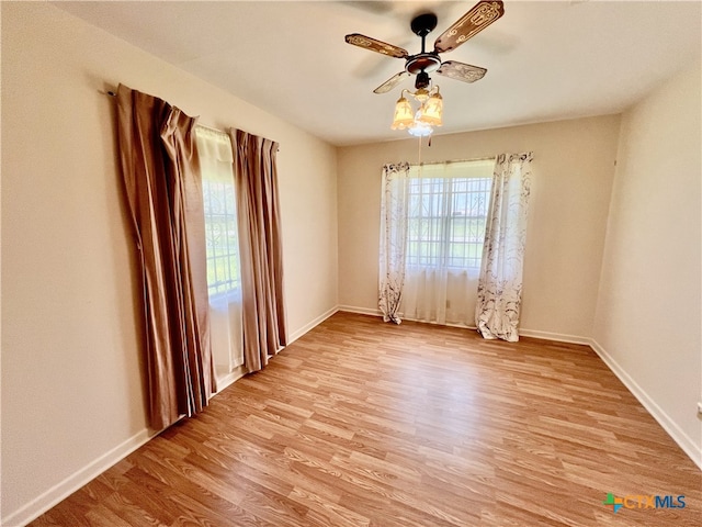 unfurnished room featuring ceiling fan and light hardwood / wood-style flooring