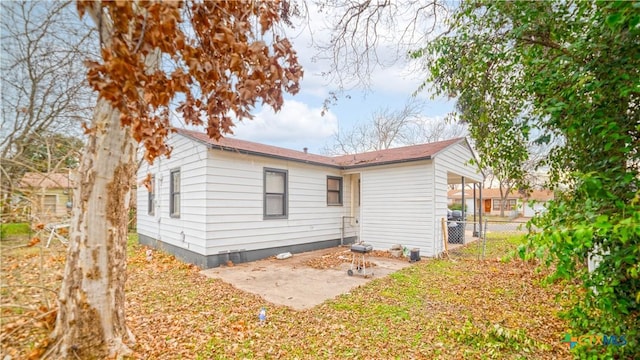 back of property featuring a patio area