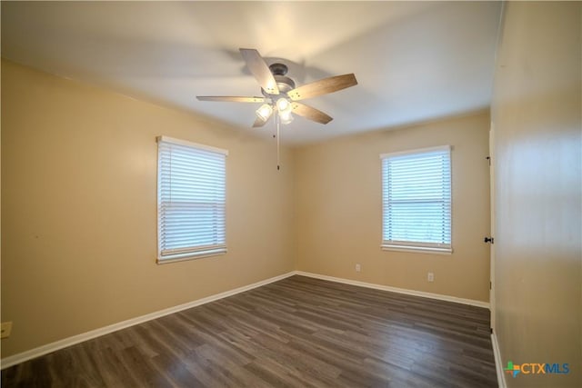 unfurnished room with ceiling fan and dark hardwood / wood-style floors