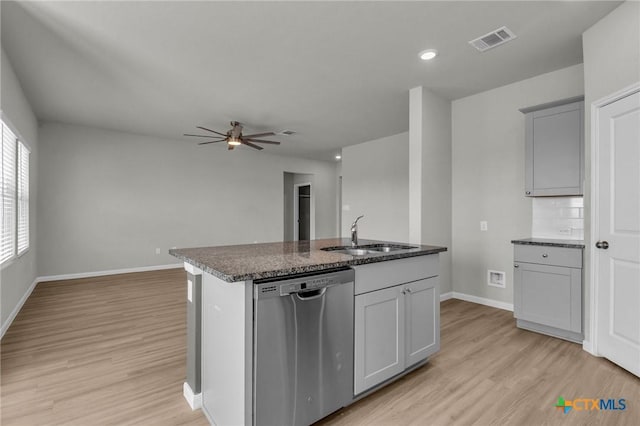 kitchen featuring dishwasher, light hardwood / wood-style floors, ceiling fan, and sink