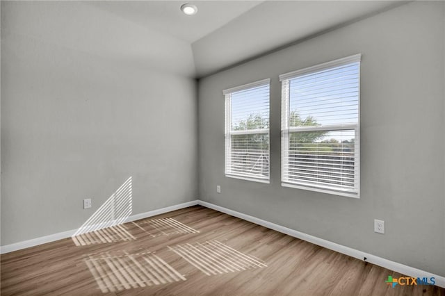 spare room featuring hardwood / wood-style floors