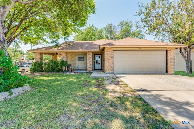 ranch-style house with a garage and a front yard