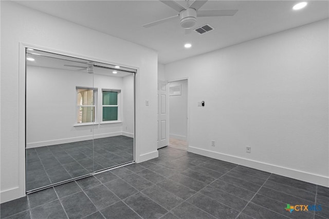 unfurnished bedroom with recessed lighting, a closet, a ceiling fan, visible vents, and dark tile patterned floors