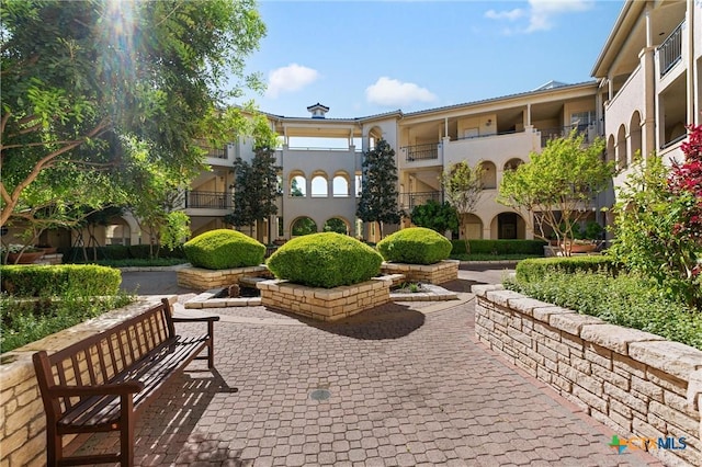 surrounding community featuring a patio area