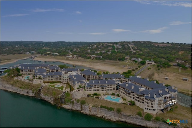 birds eye view of property with a water view