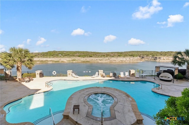 community pool with a community hot tub, a water view, and a patio area