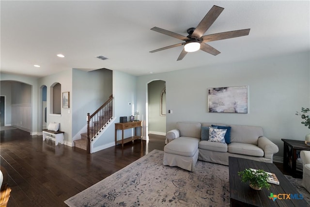 living room with dark hardwood / wood-style floors and ceiling fan