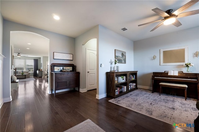 interior space featuring dark hardwood / wood-style floors and ceiling fan