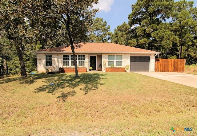 single story home with a front lawn and a garage