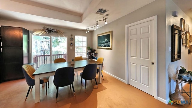 dining area featuring track lighting