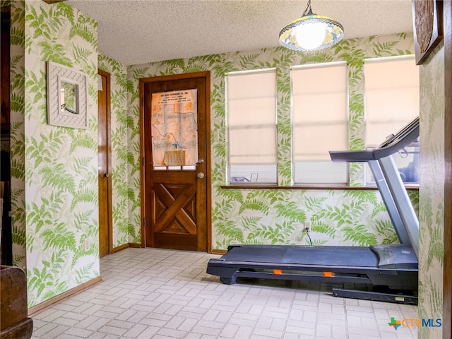 exercise area with a textured ceiling