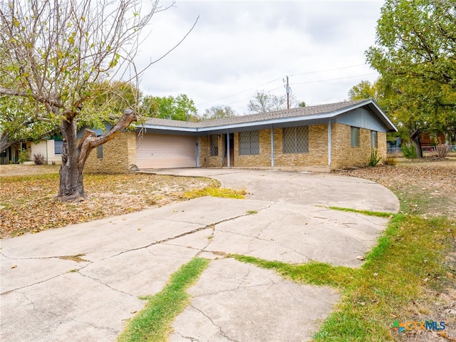 ranch-style home with a garage