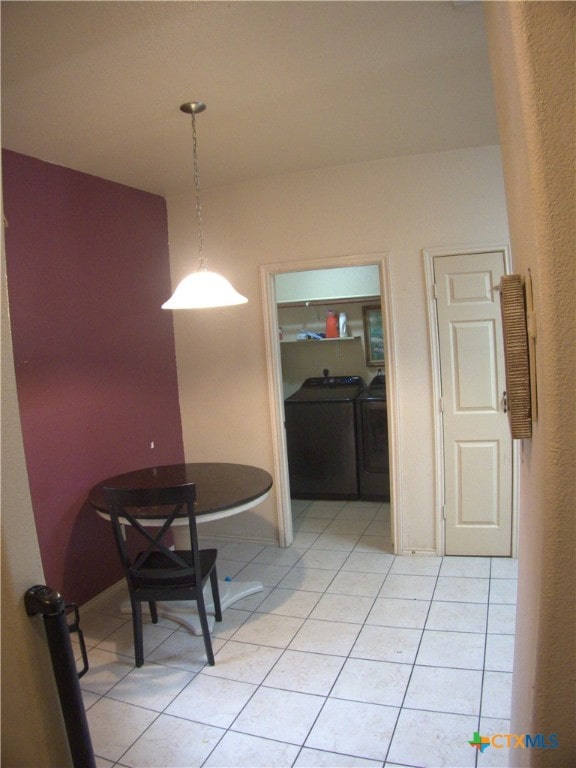 2726 Settlement Rd, Copperas Cove, TX 76522 - dining space with light tile patterned floors and washing machine and clothes dryer