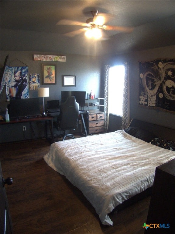 2726 Settlement Rd, Copperas Cove, TX 76522 - bedroom with wood finished floors, ceiling fan, and an office area