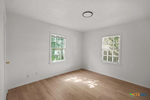 1404 Mulford St, Killeen, TX 76541 - empty room with hardwood / wood-style flooring and baseboards