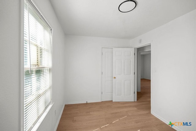 1404 Mulford St, Killeen, TX 76541 - unfurnished bedroom with light wood-type flooring