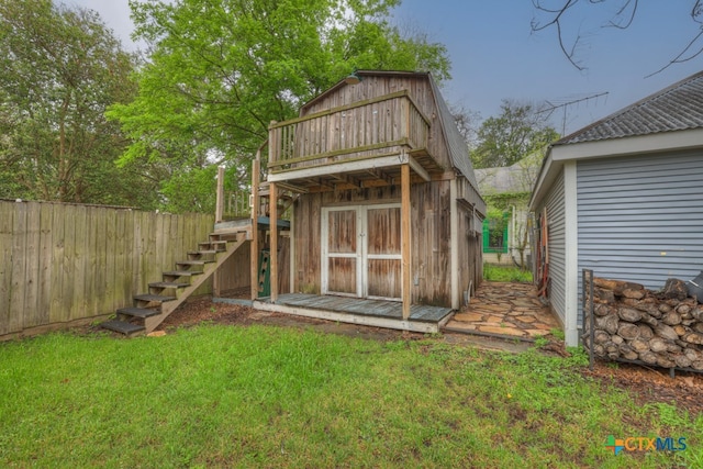 view of outdoor structure featuring a lawn