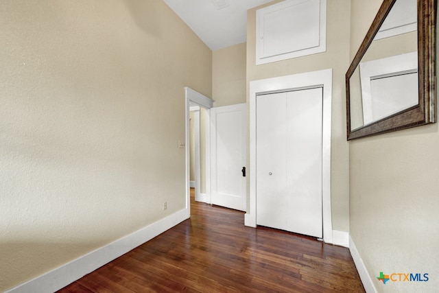 interior space featuring a closet and dark hardwood / wood-style floors