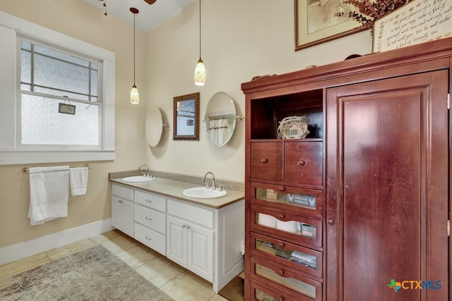 bathroom with tile patterned flooring and vanity